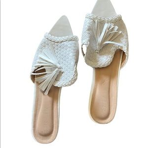 White slide on mules with tassel
